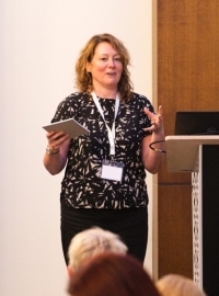 Dr Louise Hughes speaking at a conference